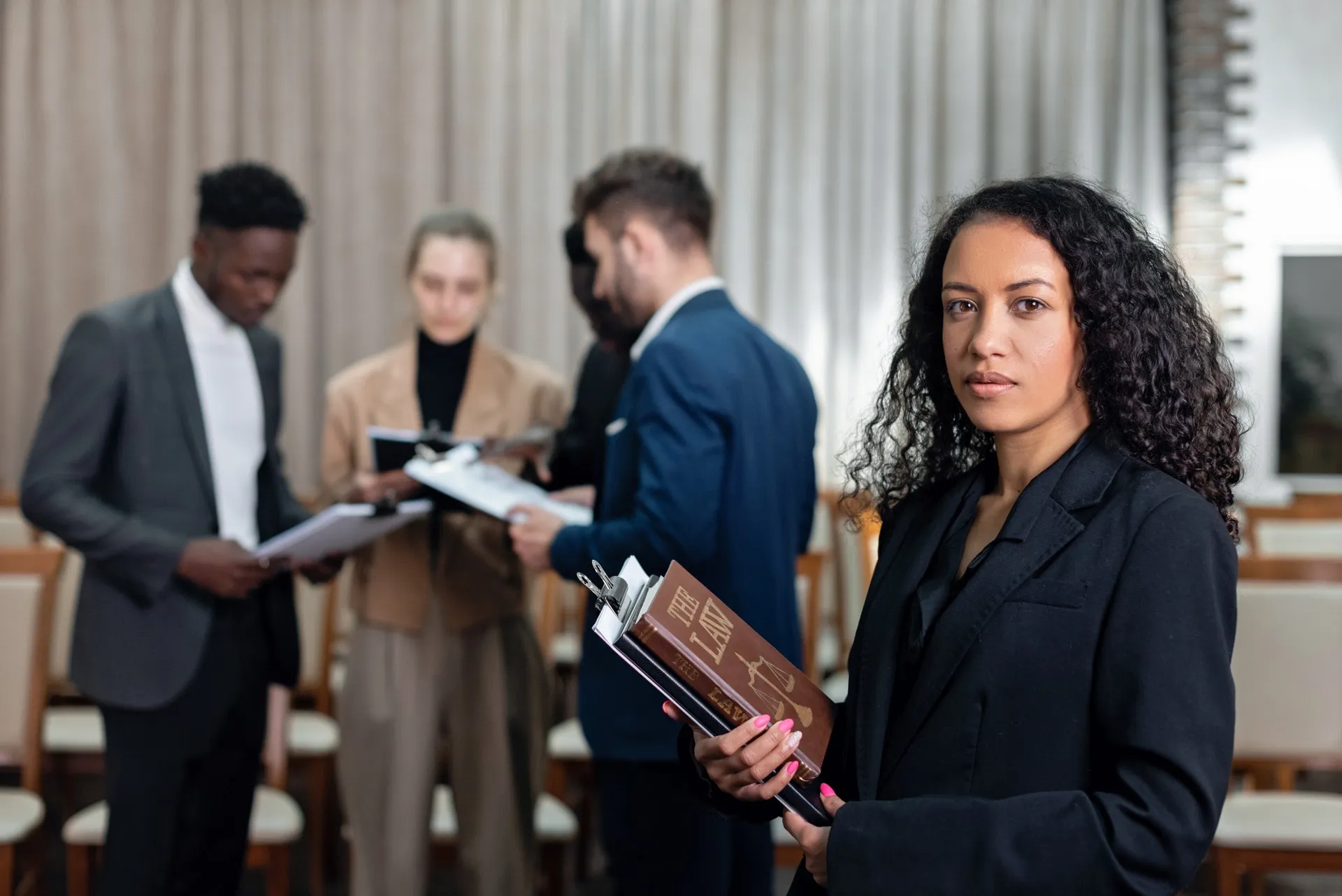 Conference organizer holding books