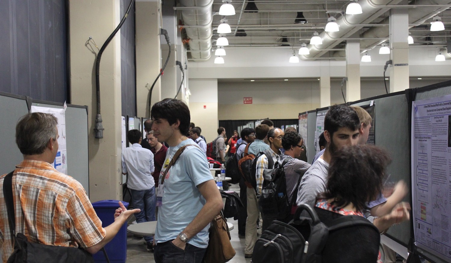Researchers discussing at a poster session