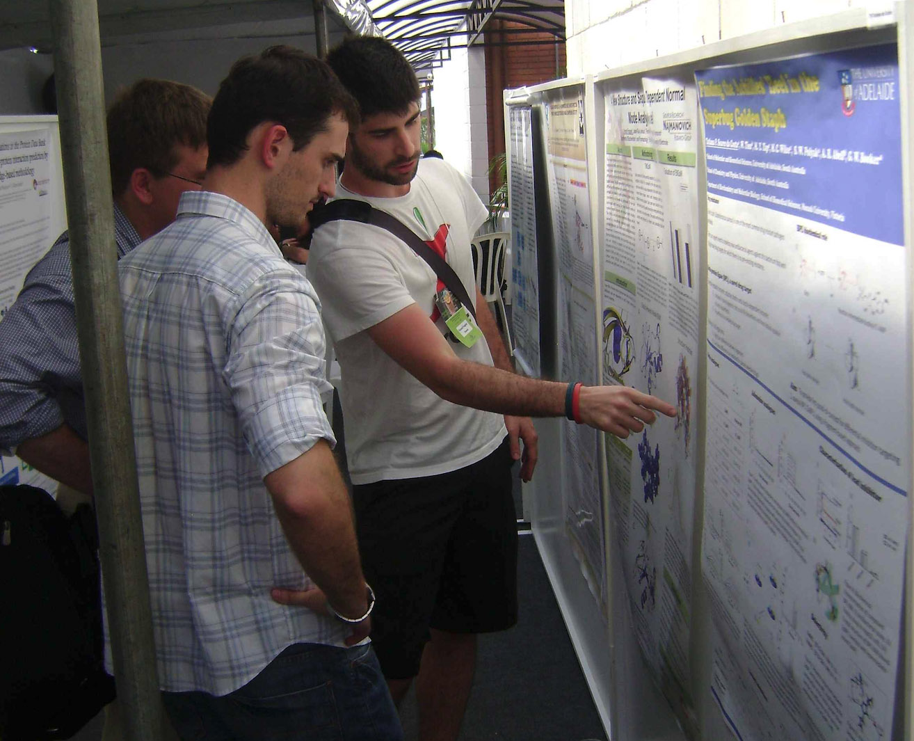 Presenter showing his poster