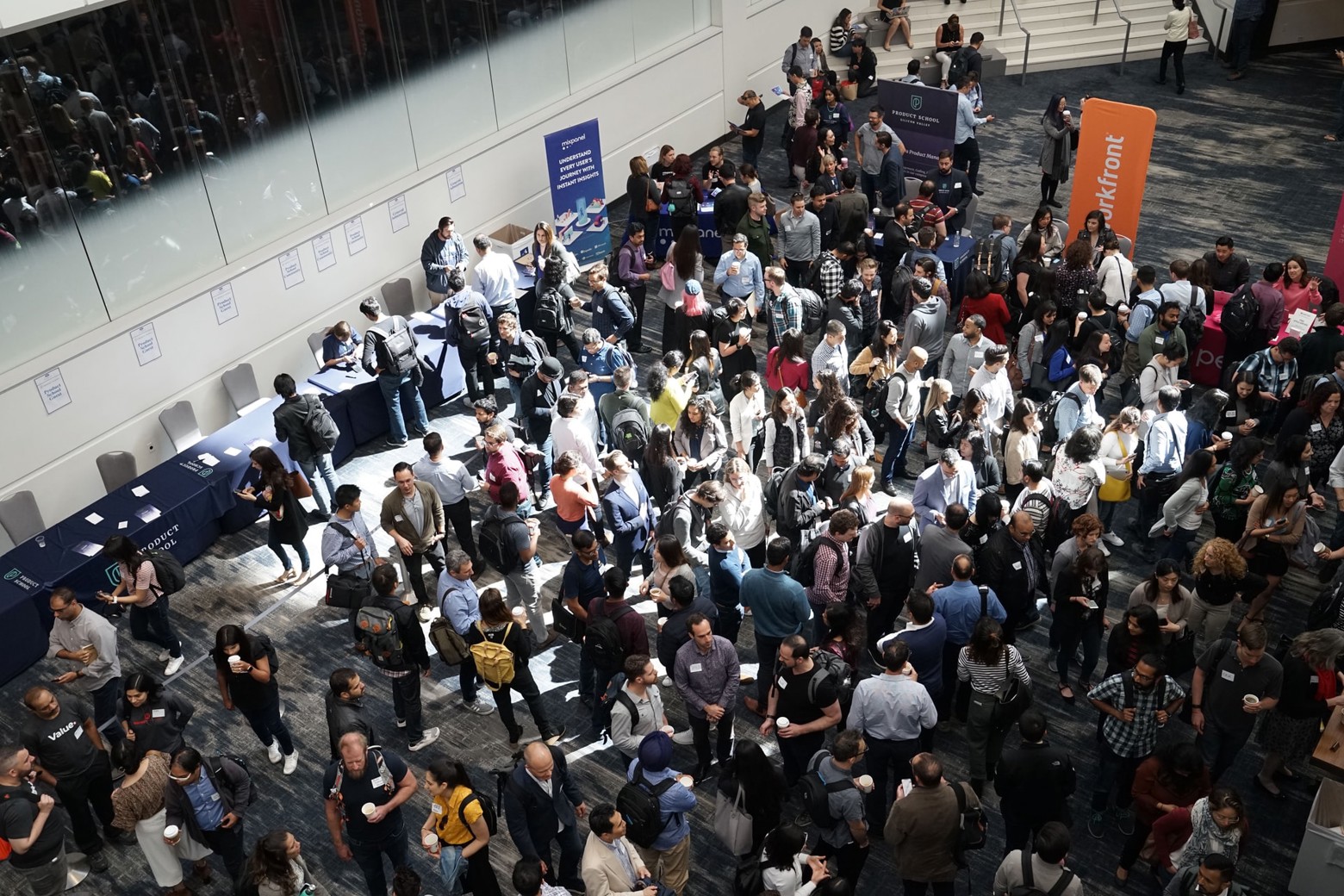 crowd of people networking at a conference