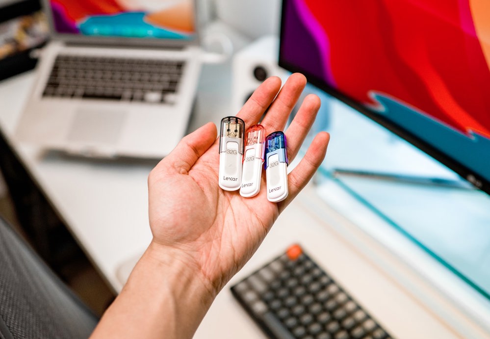 what is conference presenting Person holding USB keys